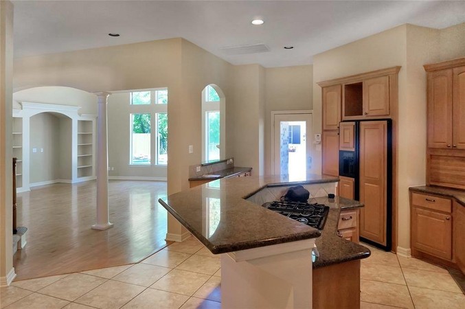 KITCHEN WITH GRANITE COUNTERS AND CUSTOM CABINETS